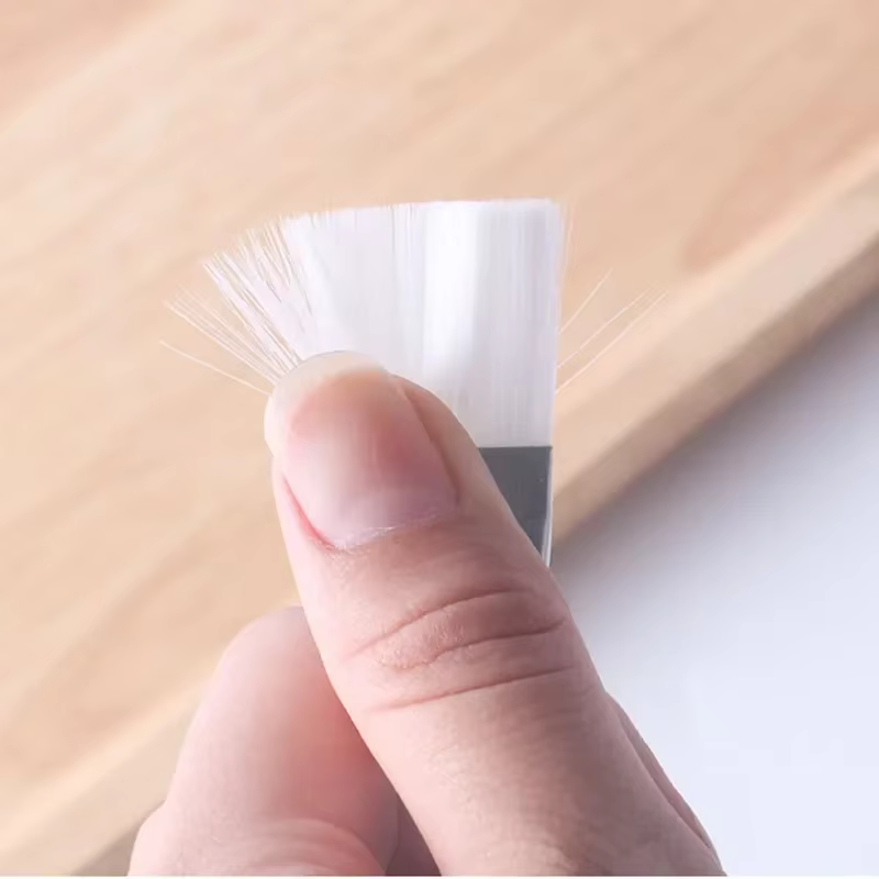 Brosse à masque à poignée transparente