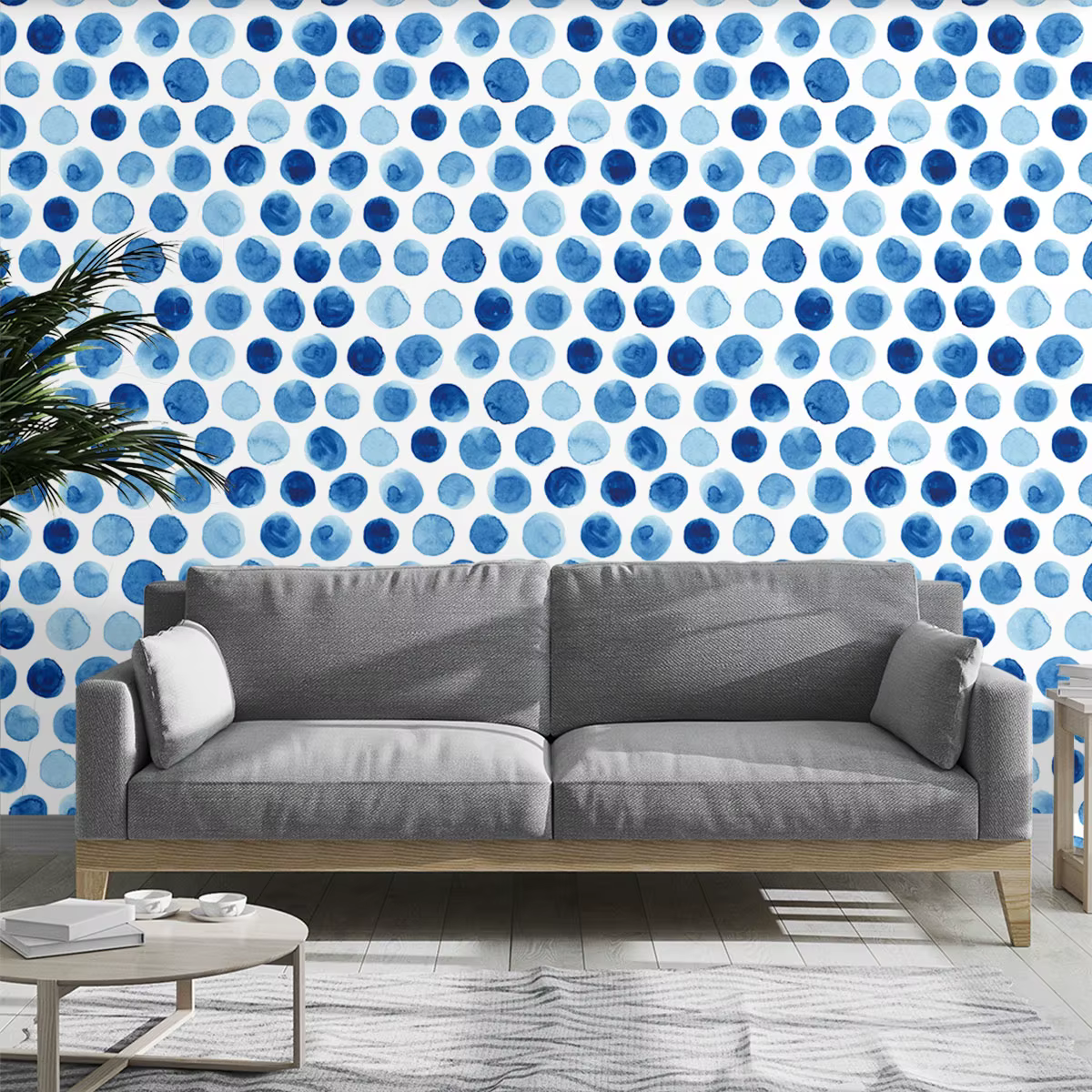 Un rouleau de papier peint cyclique à motif de pois dégradés bleus et blancs.